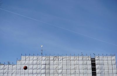 Low angle view of building against blue sky