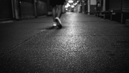 Man walking on street at night