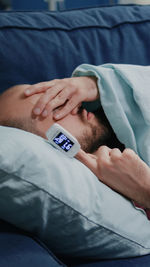 Portrait of man sleeping on bed