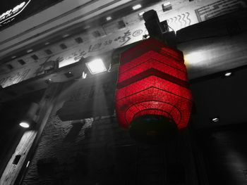 Low angle view of lanterns hanging on wall