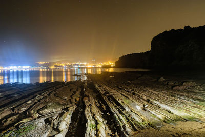 Panoramic view of beach against sky at night