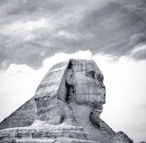 Statue of liberty against cloudy sky