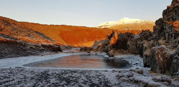 Scenic view of mountains against sky during sunset