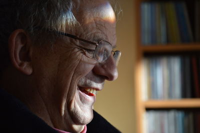 Close-up of happy senior man at home