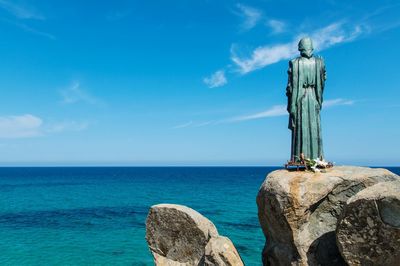 Scenic view of sea against blue sky