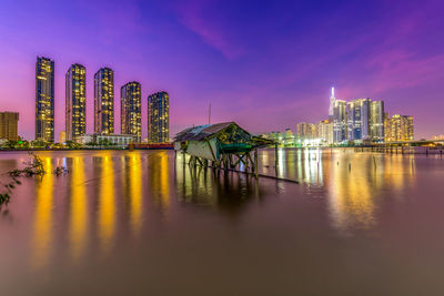 Illuminated buildings in city at night