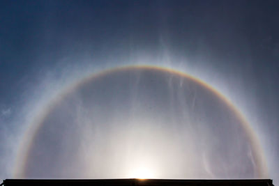 Low angle view of rainbow in sky