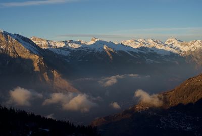 Scenic view of snowcapped mountains against sky