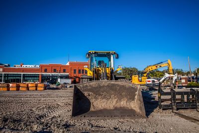 View of construction site against clear blue sky