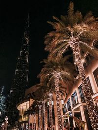 Low angle view of illuminated buildings at night