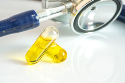 Close-up of yellow lamp on table