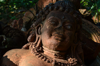 Ancient terracotta statue sculpture.