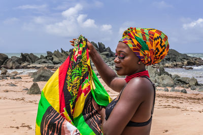 Ghana woman on the beautiful beach of axim, located in ghana west africa