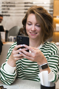 Young woman using mobile phone