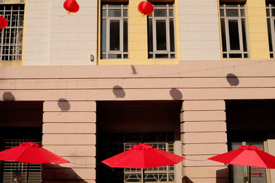 Low angle view of buildings in city on sunny day