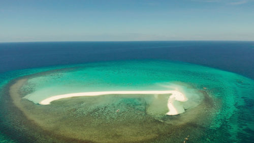 Scenic view of sea against clear blue sky