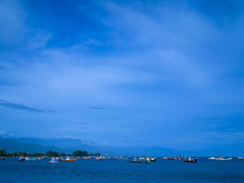Scenic view of sea against blue sky