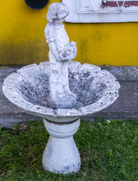 Statue of fountain in yard
