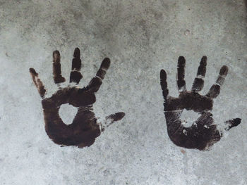 Close-up of human hand on snow