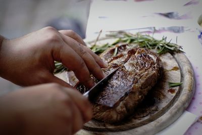 Close-up of man preparing food