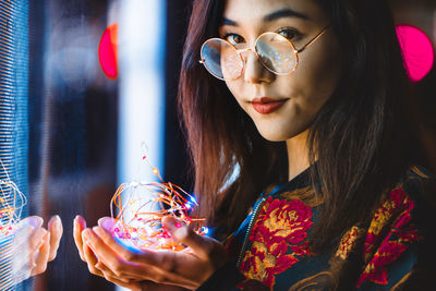 Portrait of woman holding ice cream