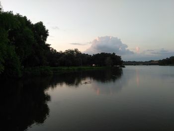 Scenic view of lake against sky at sunset