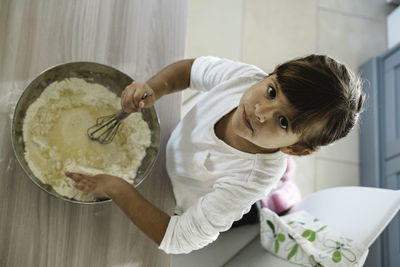 High angle portrait of cute girl at home