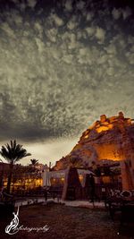 View of buildings against cloudy sky