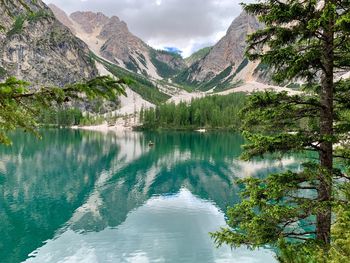 Scenic view of lake and mountains against sky