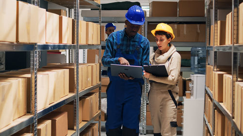 Rear view of man working in factory