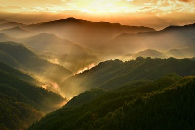 Scenic view of mountains against sky during sunset