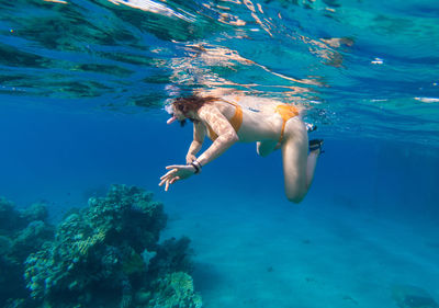 Woman snorkeling in sea