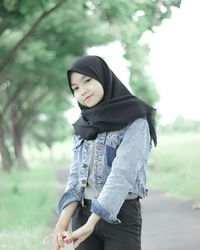 Full length of woman standing on field