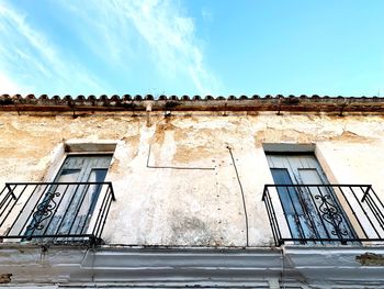 Low angle view of old building against sky