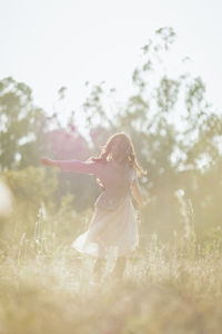 Woman standing on field