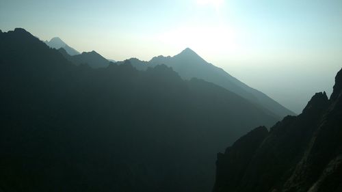 Scenic view of silhouette mountains against clear sky
