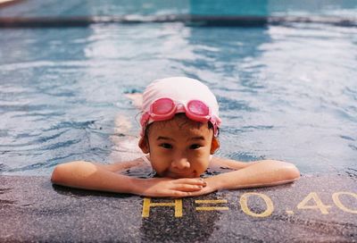 Portrait of girl swimming in pool