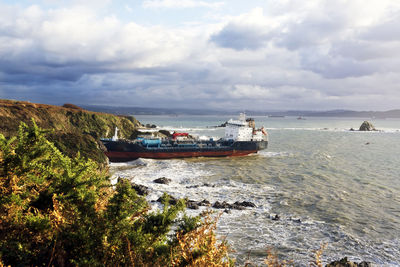 Ship tanker wreck on cliffs of atlantic coast , wrecked boat , danger of contamination