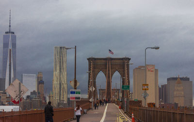 View of city buildings against cloudy sky