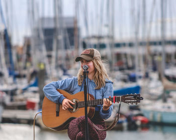 Young woman playing guitar