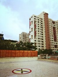 Buildings in city against sky