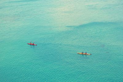 High angle view of boats in calm blue sea