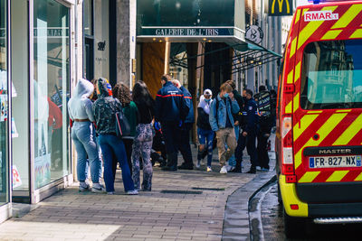 People walking on street in city