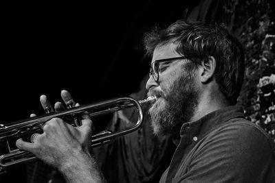 Low angle view of man playing musical instrument