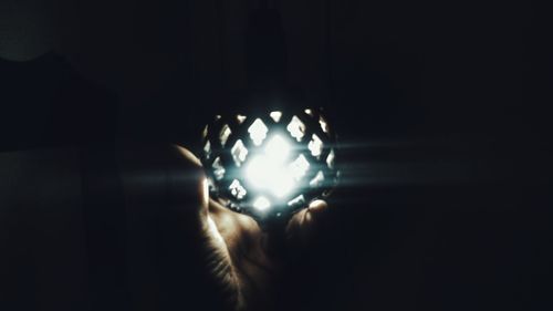 Close-up of illuminated lighting equipment at night