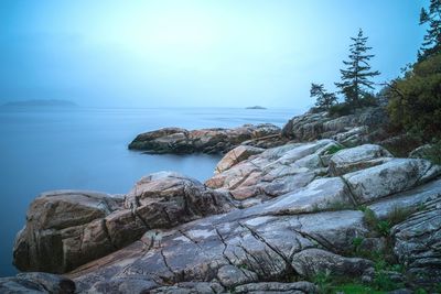 Scenic view of sea against blue sky