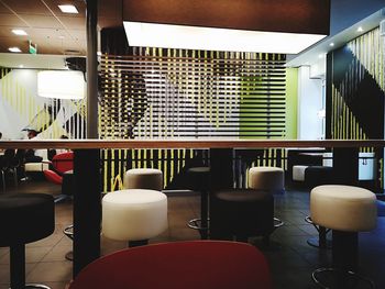 Empty chairs and tables in restaurant