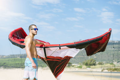 Man windsurfing at beach