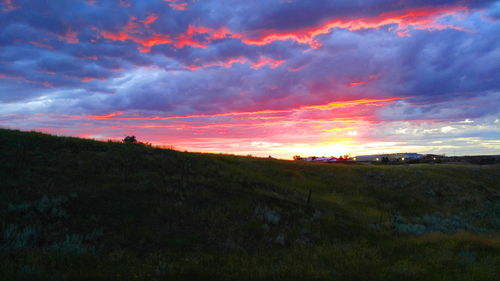 Scenic view of landscape against cloudy sky