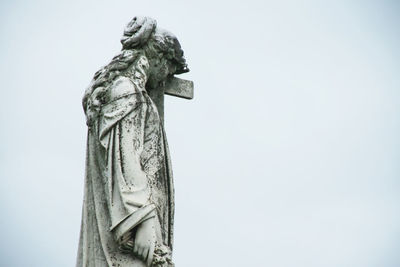 Low angle view of statue against sky